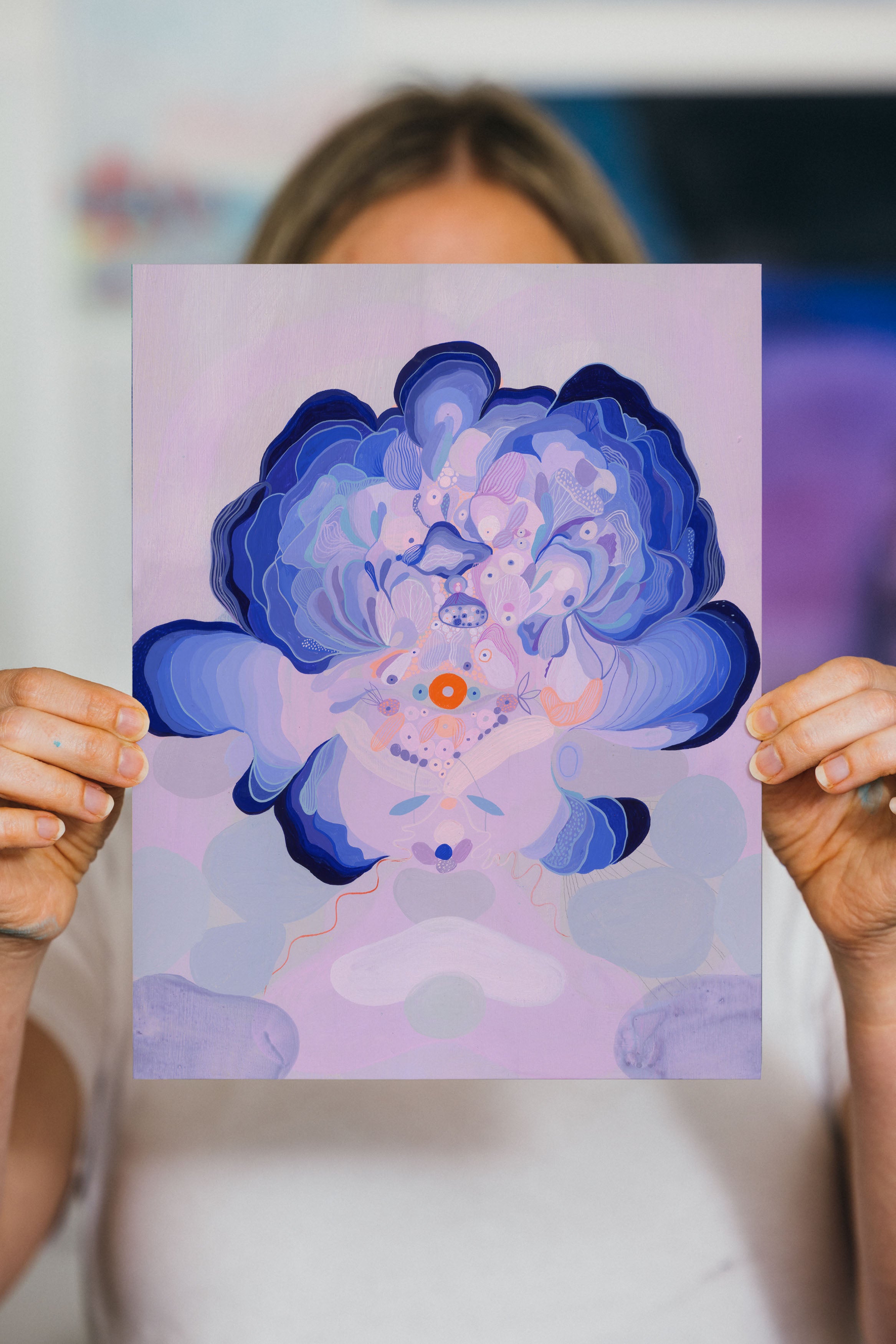 Person holding the Ultramarine Orb art print in studio.