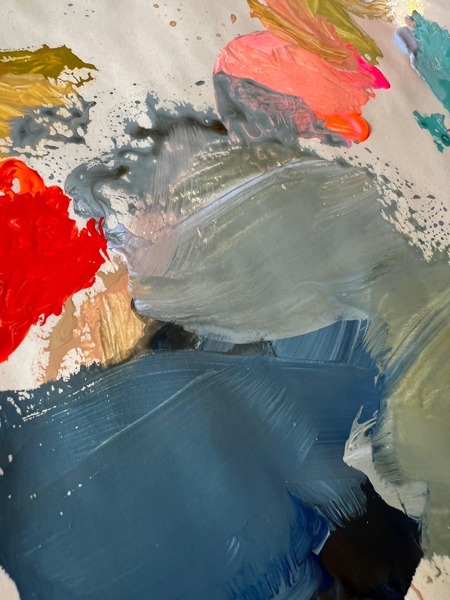 Abstract painting detail with layered blue and green tones and small areas of coral and red.