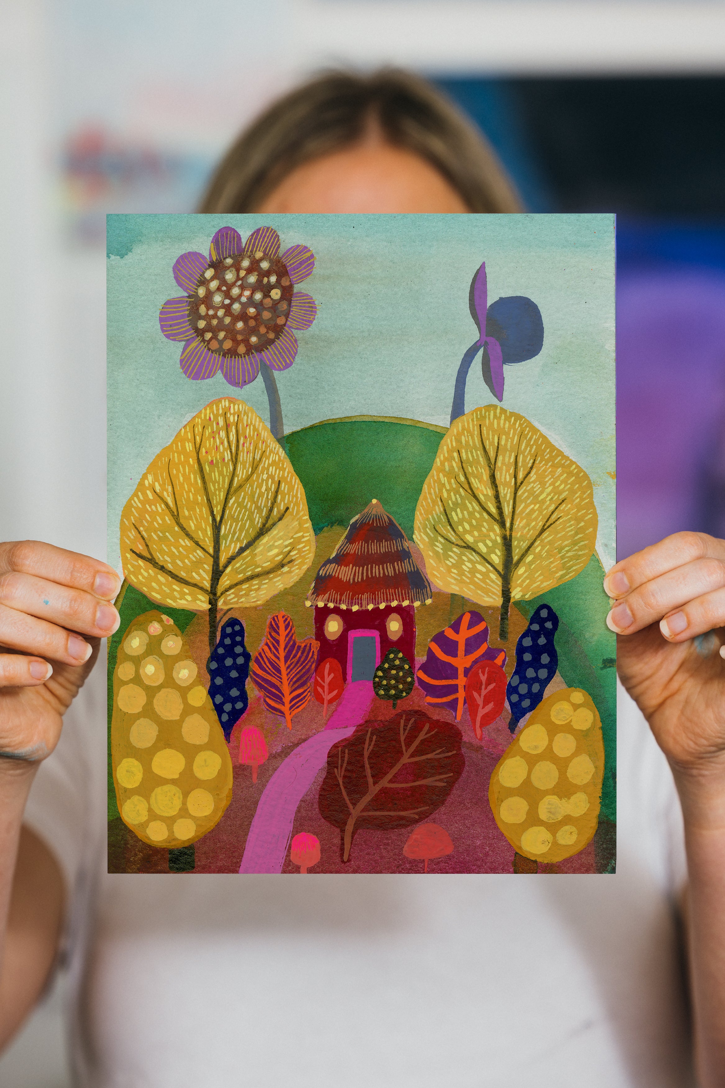 Whimsical art print of a tiny yurt nestled among oversized yellow trees, bright foliage, and rolling hills.